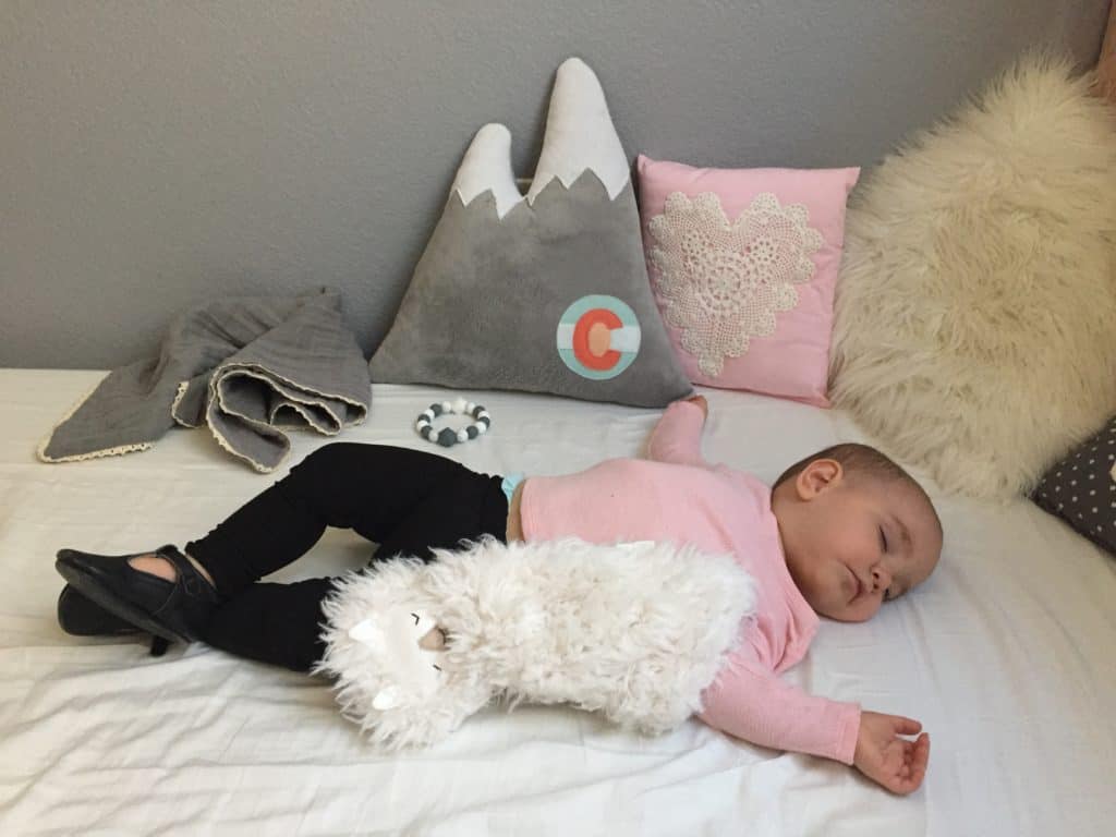 DIY Mountain Nursery with Wall Mural 5 Baby girl sleeping with mountain pillow in her new DIY mountain themed nursery
