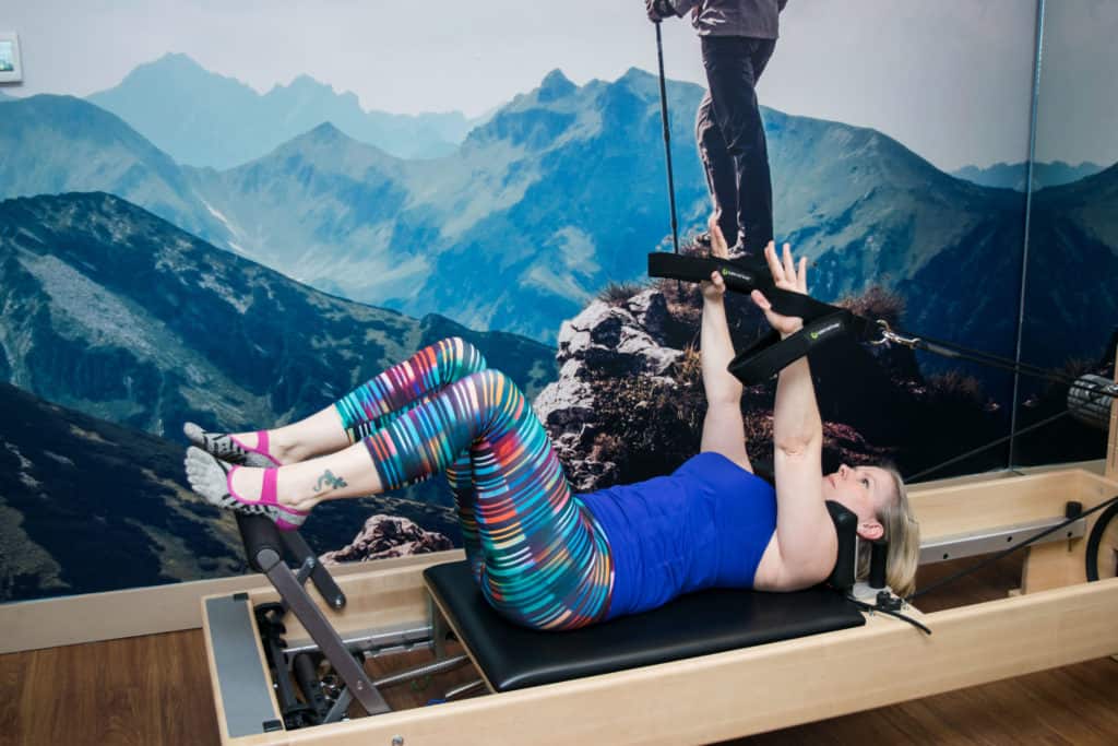 Momblogger Amanda Seghetti on reformer at Club Pilates