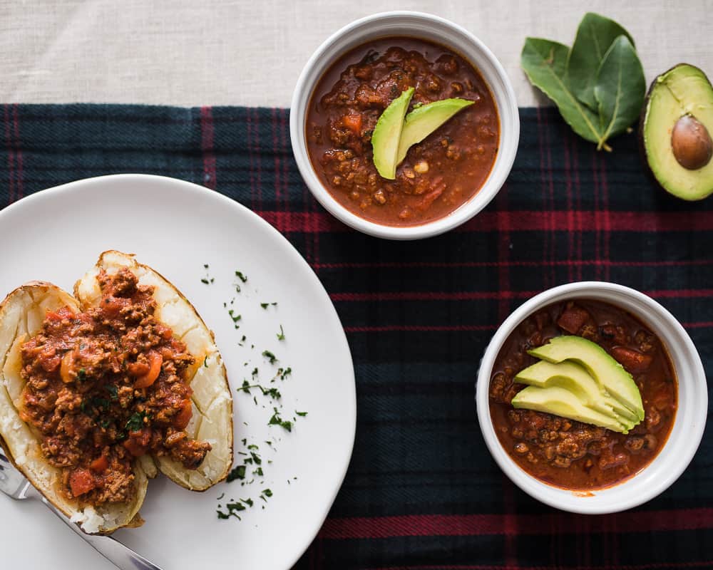 Whole30 chili with avocado and baked potato