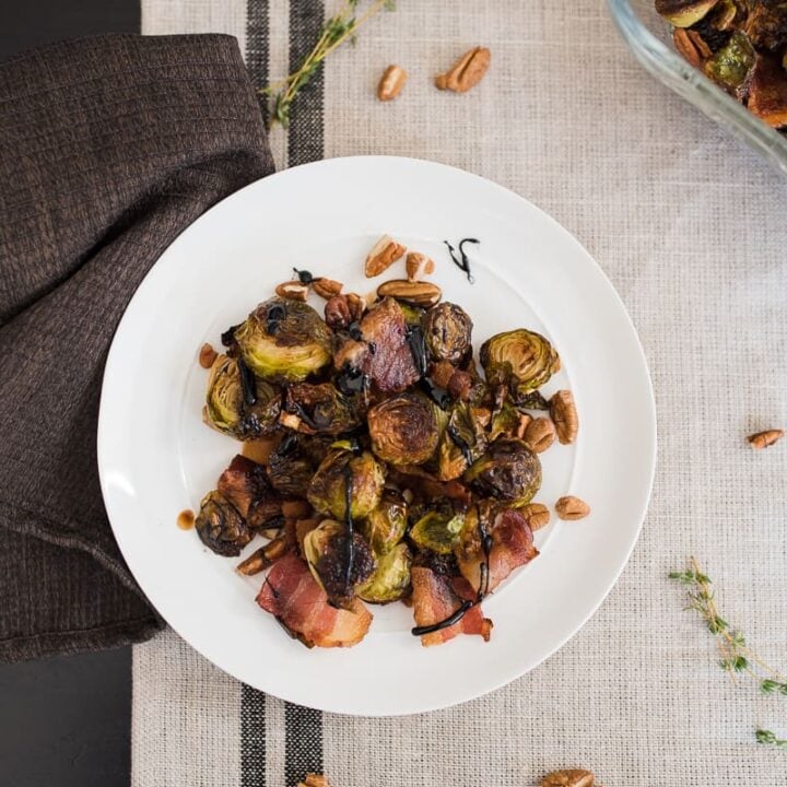 Roasted Brussels Sprouts with Bacon and Pecans 4 plate of roasted brussels sprouts with balsamic drizzle