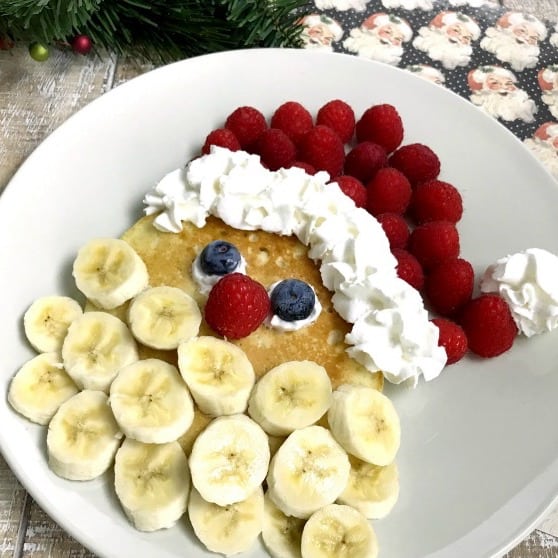 Santa pancakes loaded with fruit.