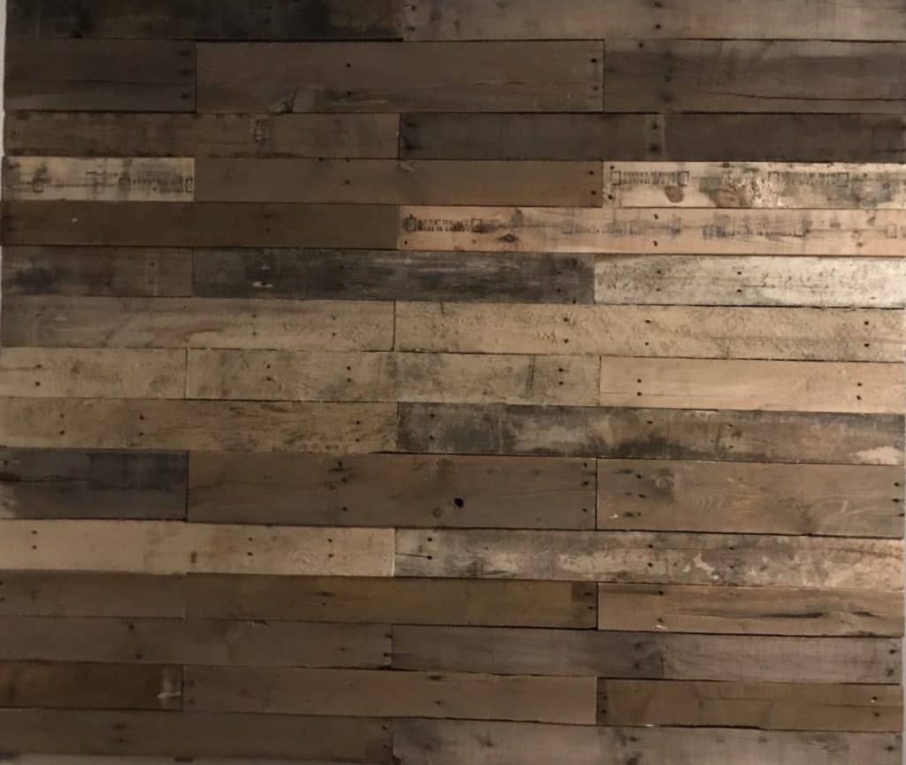 completed DIY pallet wall in laundry room makeover