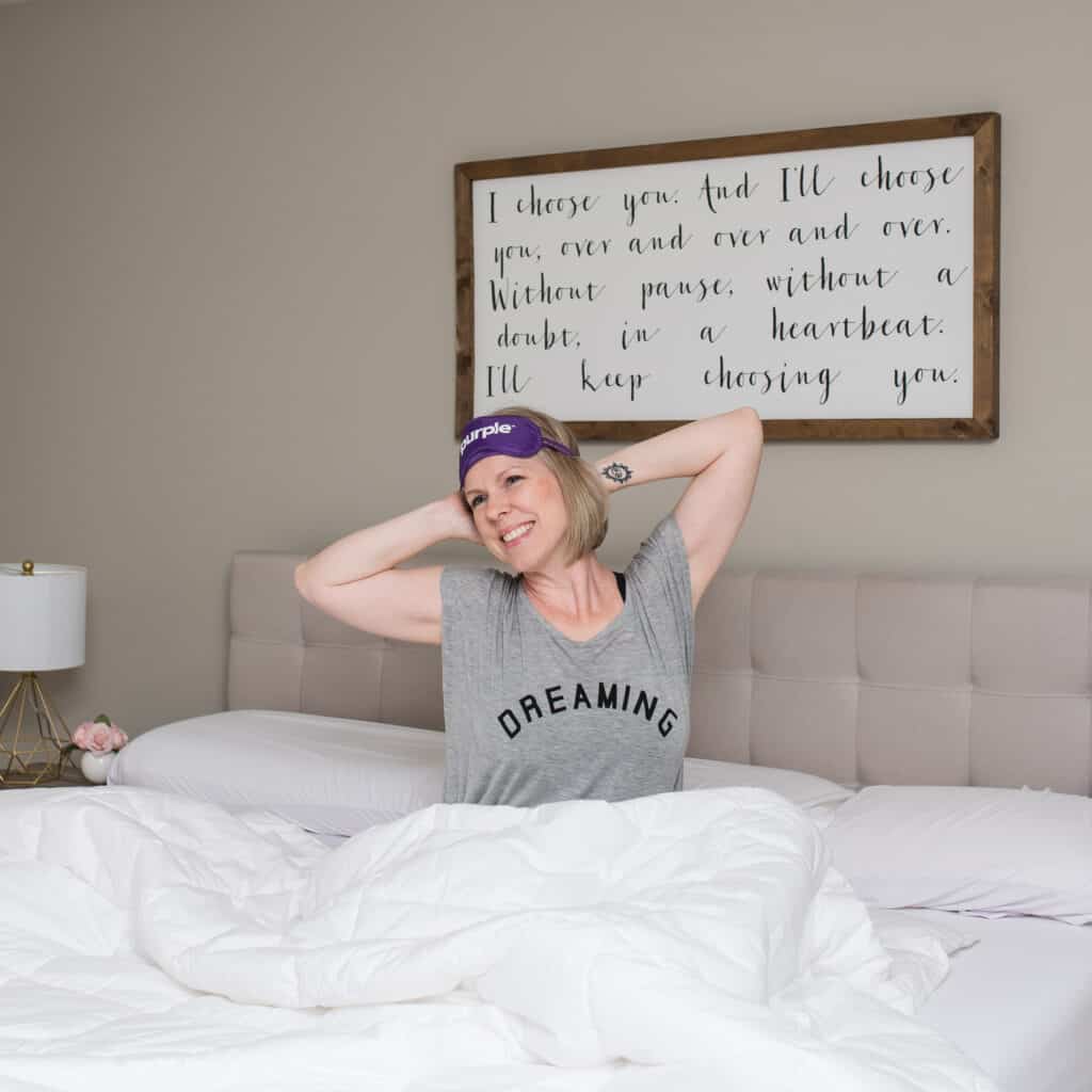 stretching after sleeping on purple mattress